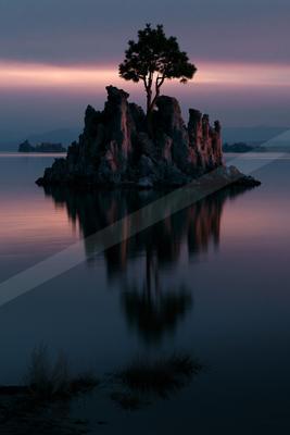 A black-toned moody photograph of lakeside, cliff, seashore.
