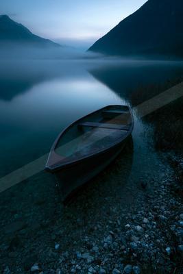 A blue hour long exposure still life of boat, reflection.