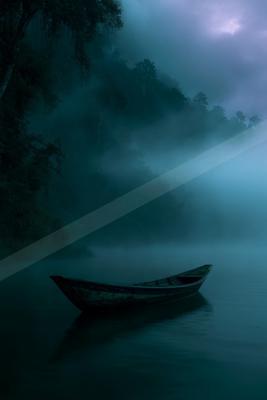 A serene water scene of lake, fog.