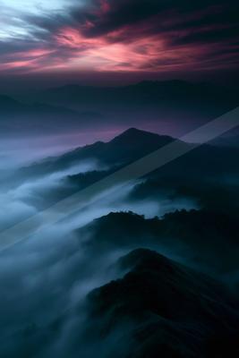 A blue hour landscape of mountains, valley.