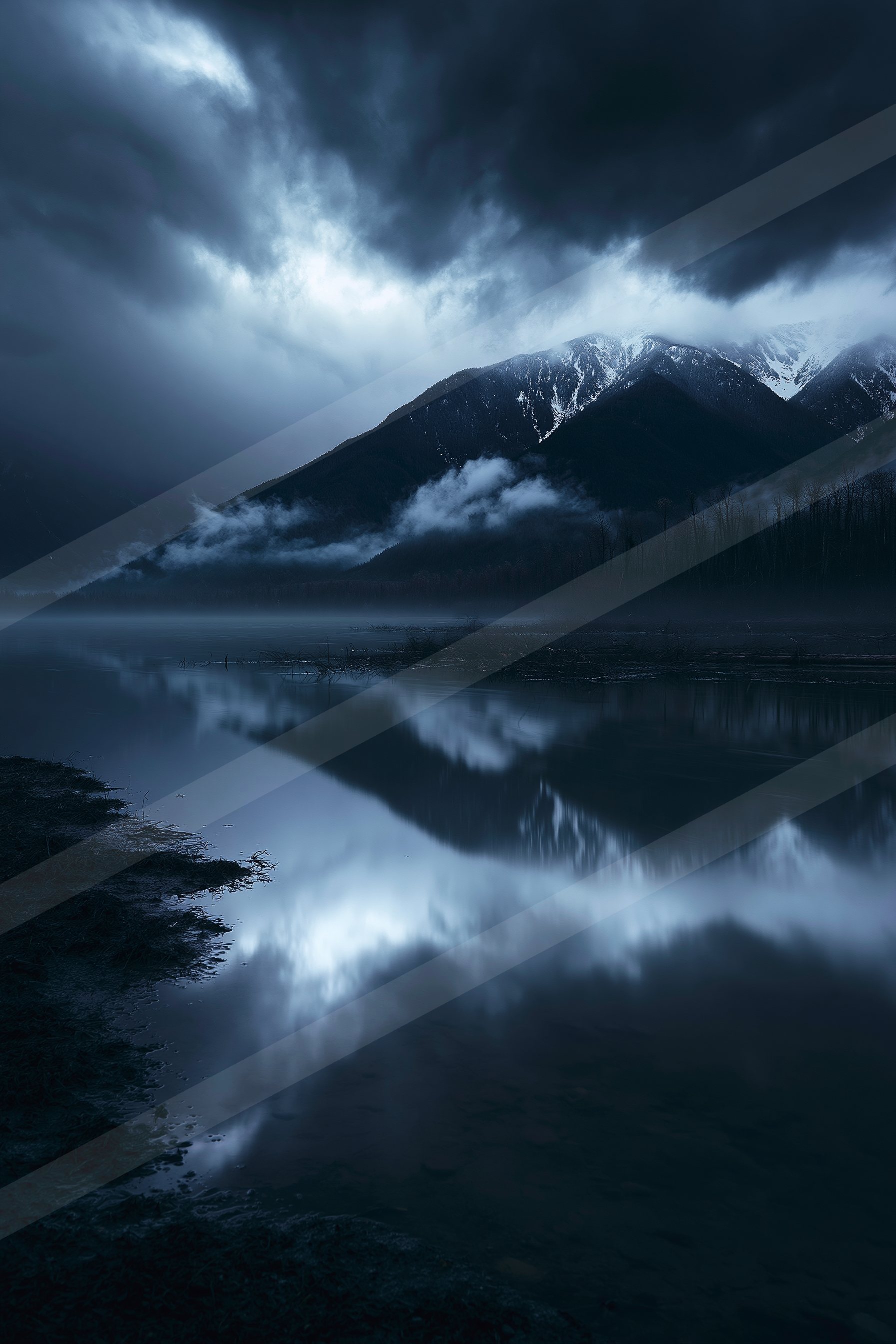 A serene nighttime landscape featuring a calm lake reflecting the silhouettes of snow-capped mountains under a moody, cloudy sky.