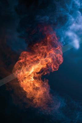 A black-toned moody photograph of volcano, torch, matchstick.