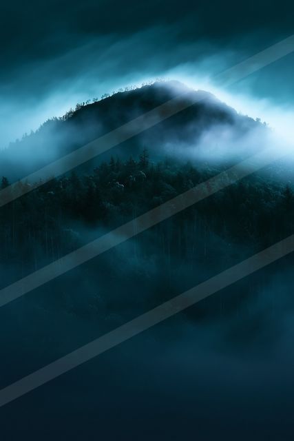 A blue hour double exposure landscape of a rolling hills, fog.