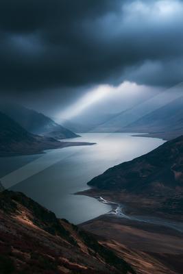 A green-toned moody photograph of valley, lakeside, dam.