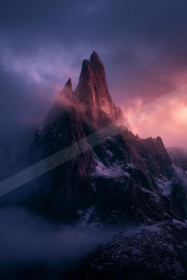 A moody landscape of mountains.