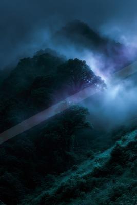 An ethereal long exposure landscape of a mountains, fog.
