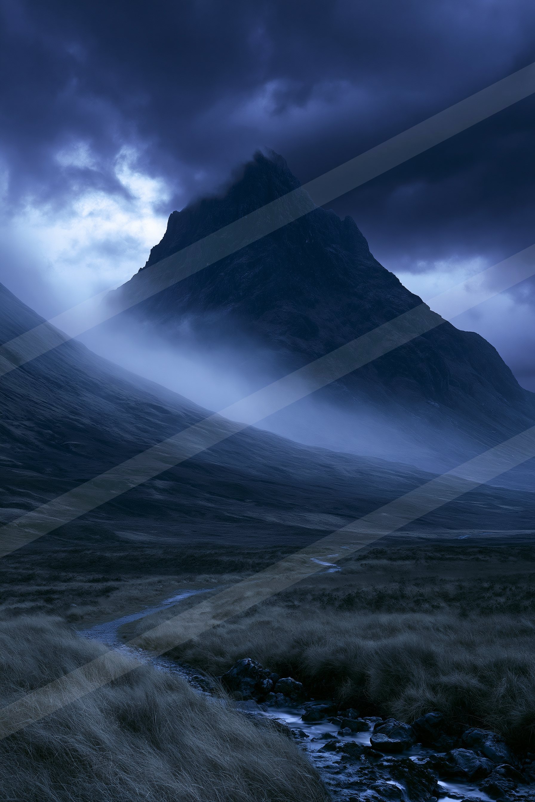 An ethereal long exposure landscape of a mountains, fog.