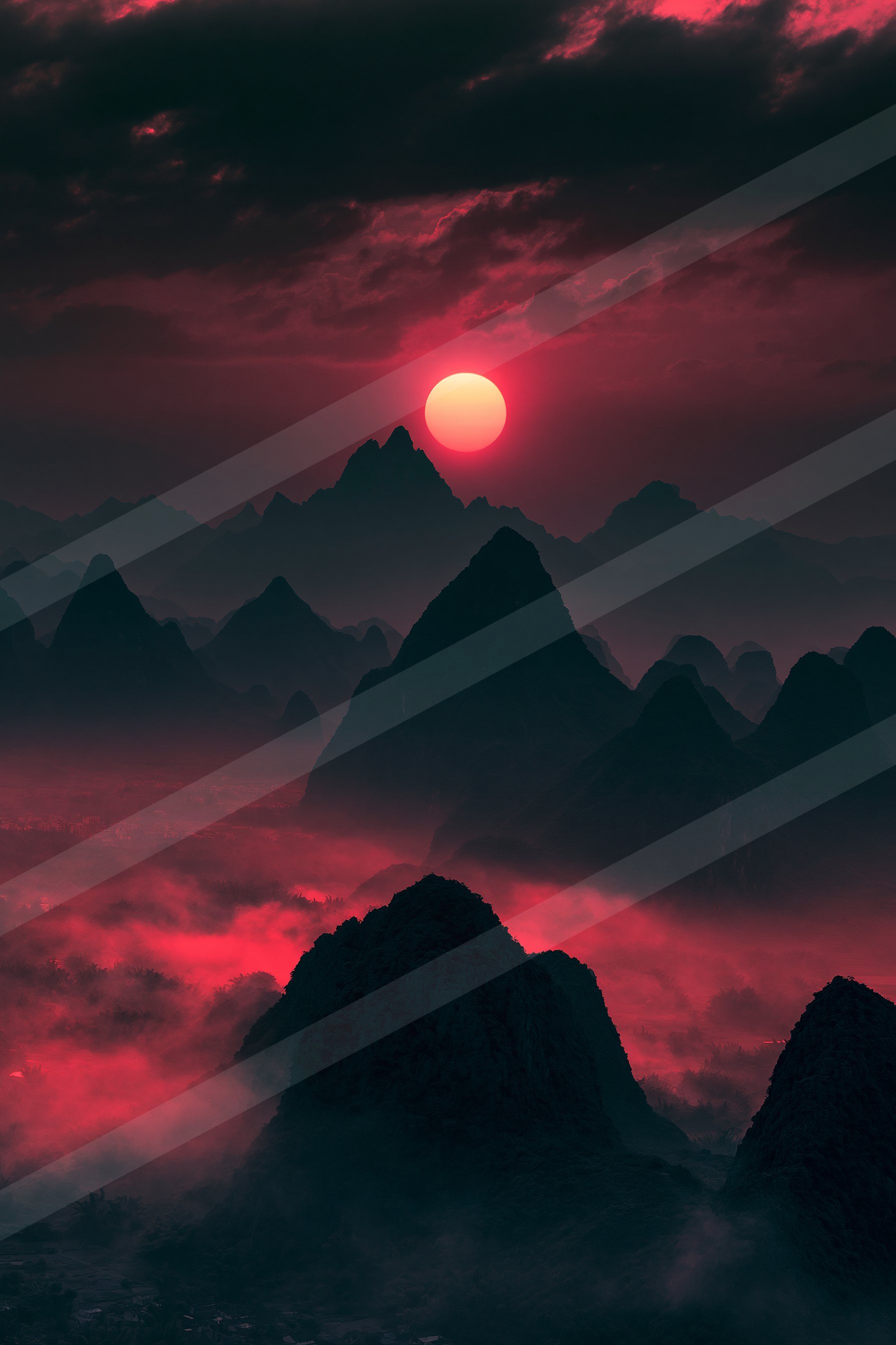 A striking red sunset casts a vivid glow over jagged mountain silhouettes, creating an otherworldly atmosphere.
