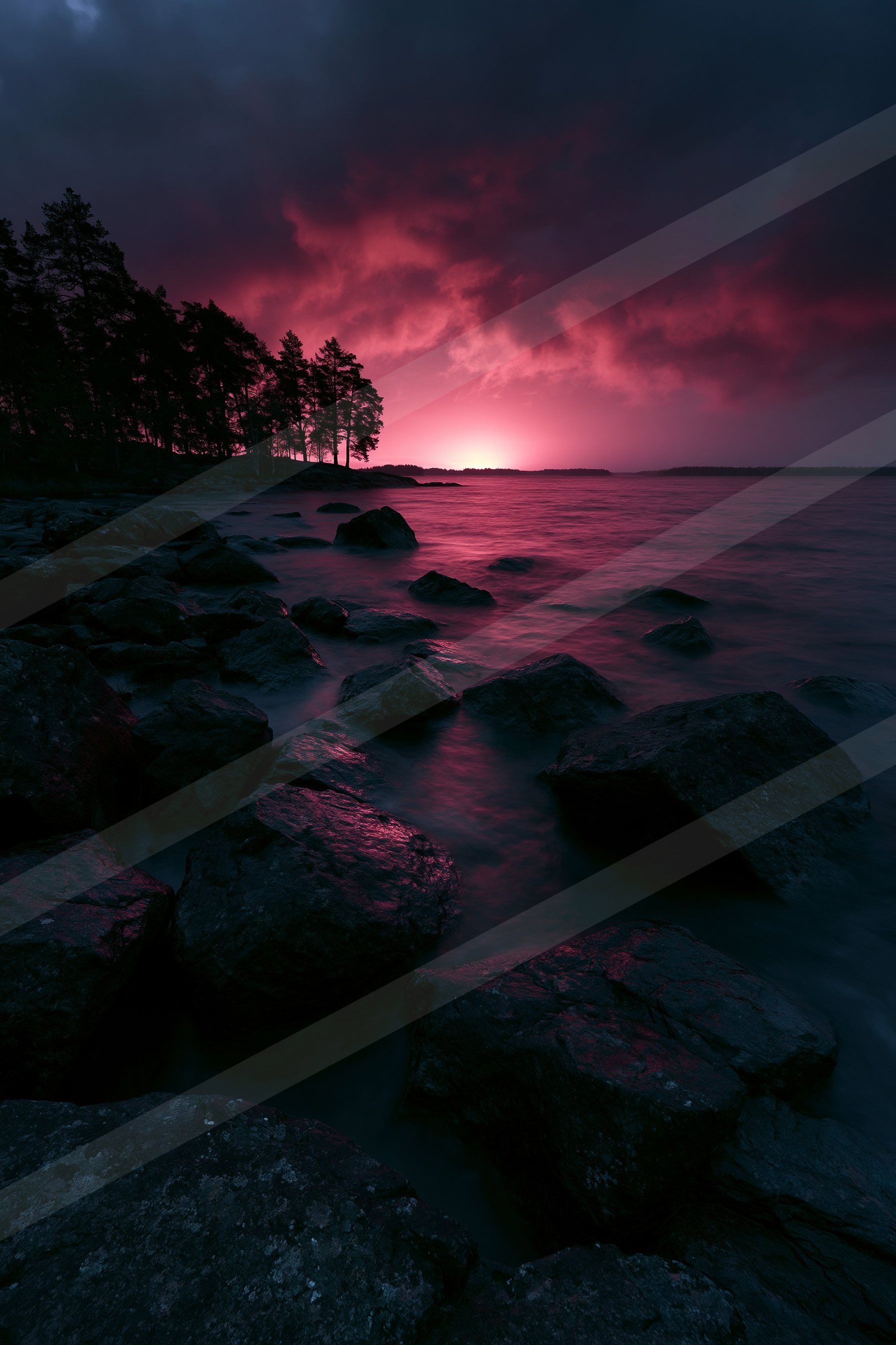A night high contrast sky scene of a sunrise, rocks.