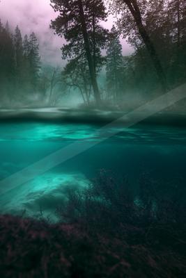 A serene water scene of river, lake, waterfall.