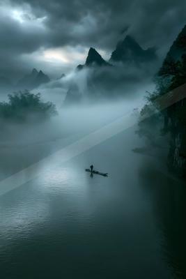 A serene landscape of mountains, lake, river.