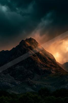 A moody landscape of mountains.