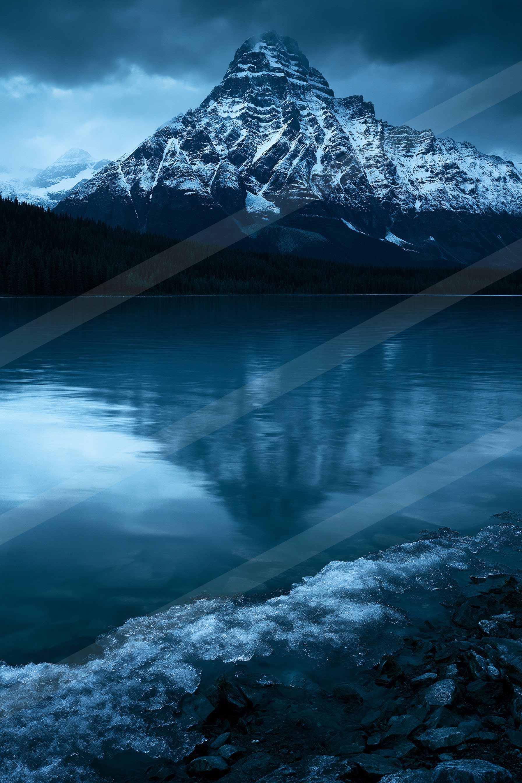 A majestic snow-covered mountain dominates the scene with its reflection perfectly mirrored on a tranquil lake, surrounded by dark evergreen trees and icy shore