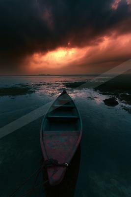 A night water scene of lake, sunset, ocean.