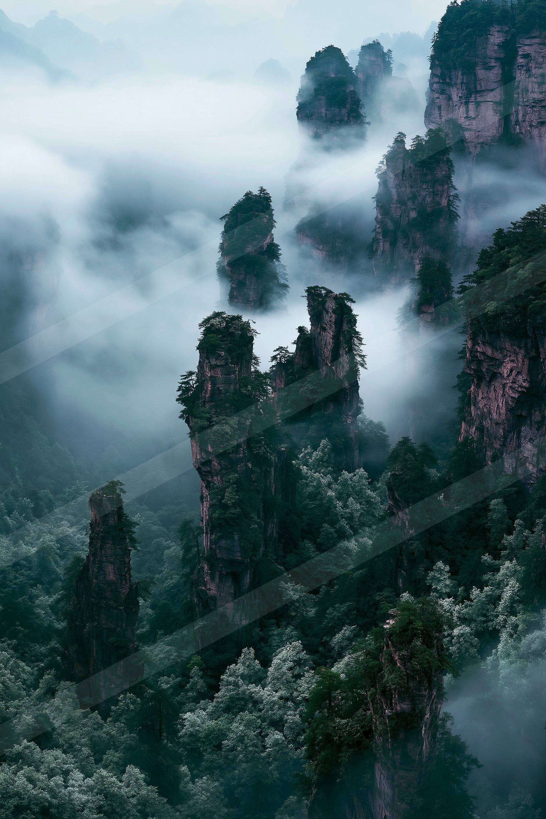 A serene landscape of towering mountain peaks shrouded in mist, surrounded by lush green forests.