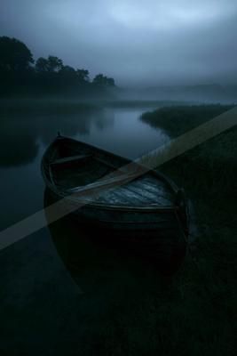 A serene water scene of lake, fog.