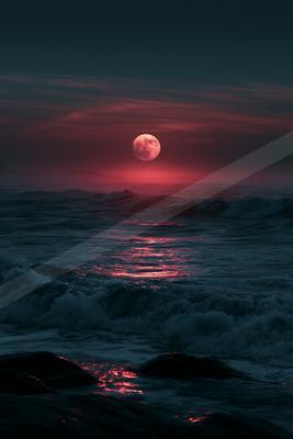 A night water scene of ocean.