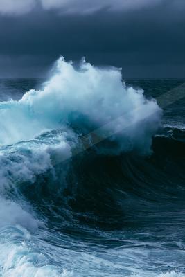 A black-toned moody photograph of breakwater, beacon, promontory.