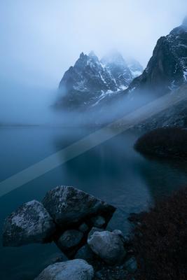 A mysterious long exposure landscape of a glacier, fog.