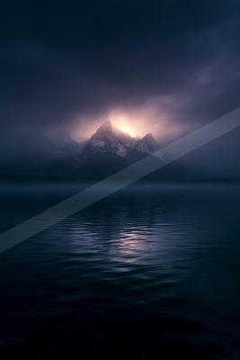 A blue hour landscape of mountains.