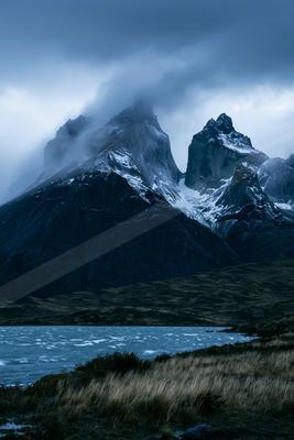 A dramatic panorama landscape of a mountains, fog.
