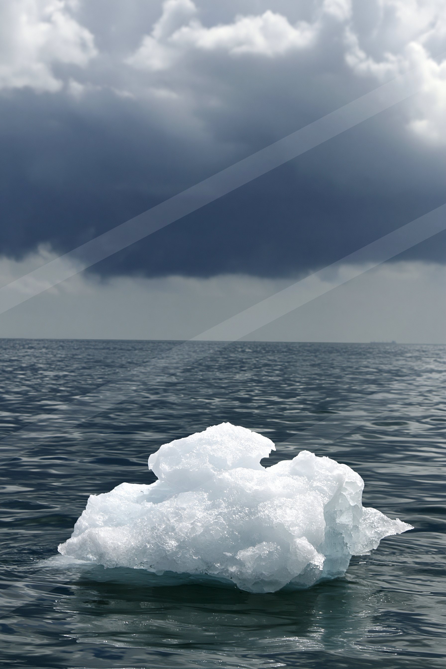 A dramatic water scene of an ocean, ice.