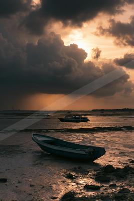 A serene sky scene of clouds, storm, ocean.