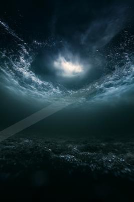 A night water scene of ocean, lake.