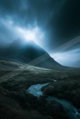 A dramatic long exposure landscape of a mountains, fog.