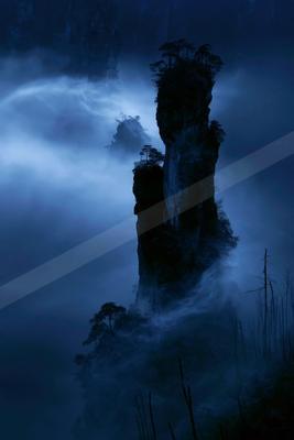 A night long exposure water scene of waterfall, fog.