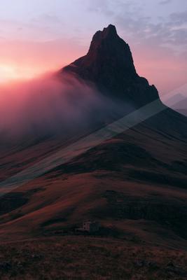 A moody landscape of mountains.