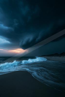 A blue hour long exposure sky scene of storm, ocean.