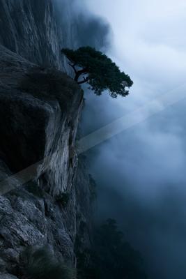 A dramatic sky scene of storm, valley, mountains.