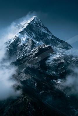 A moody landscape of mountains.