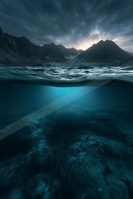 A blue hour water scene of ocean.