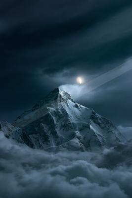 A night landscape of mountains, moon.