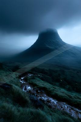 A night landscape of mountains, fog.