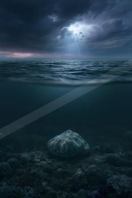 A blue hour water scene of ocean, lake, still life.