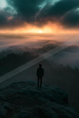 A dramatic sky scene of sunrise, sunset, silhouette.