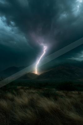 A powerful lightning bolt strikes from dark storm clouds into a mountain range, illuminating the night sky above a dry grassy plain with shrubs.