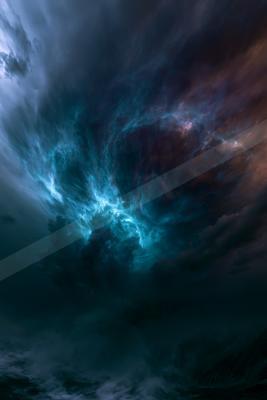 A blue hour sky scene of clouds, starry sky, storm.