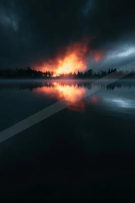 A night long exposure water scene of lake, storm, sunrise.