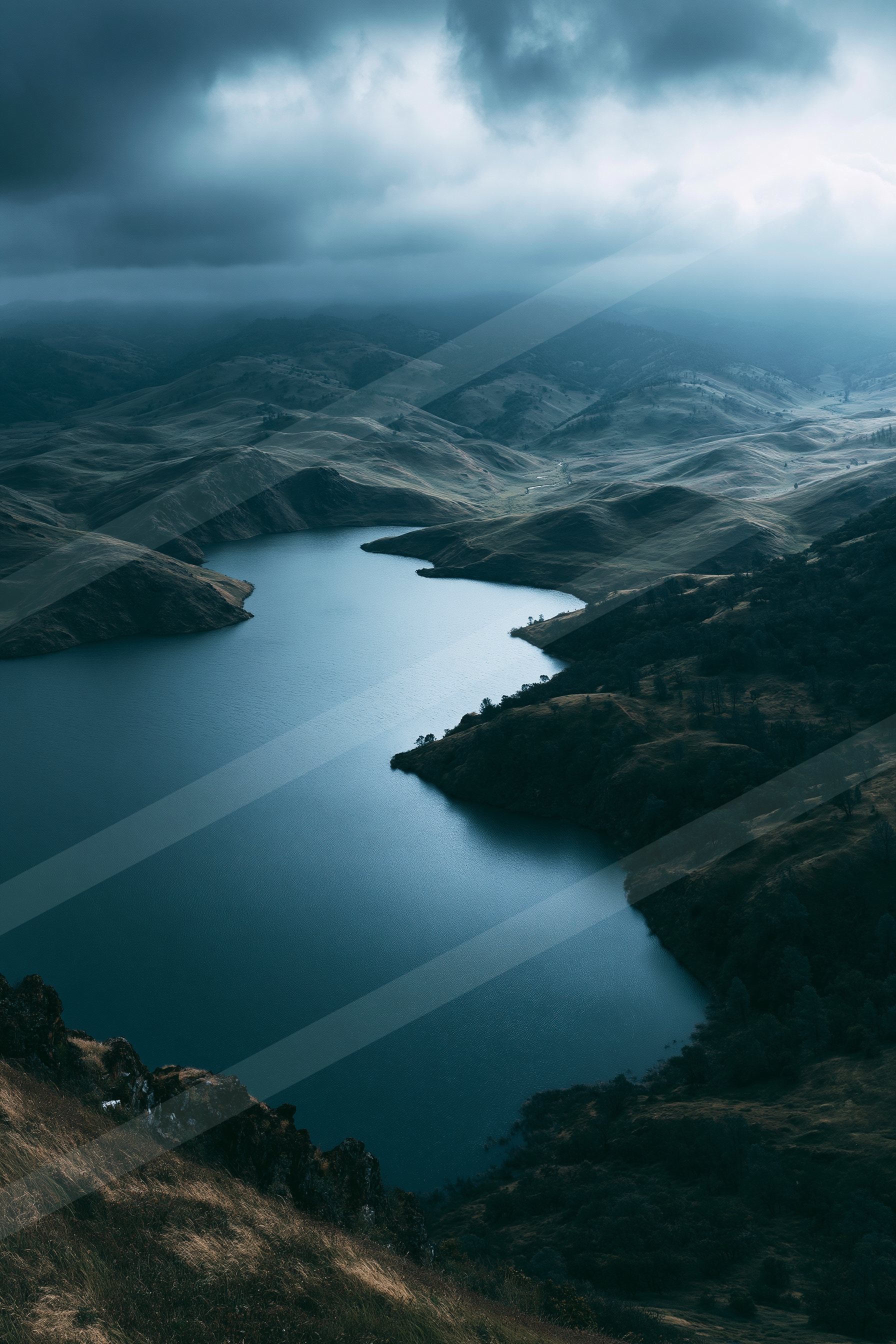A moody high contrast water scene of a lake, ripples.