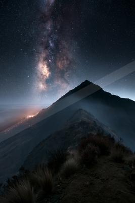 A night sky scene of starry sky, mountains.