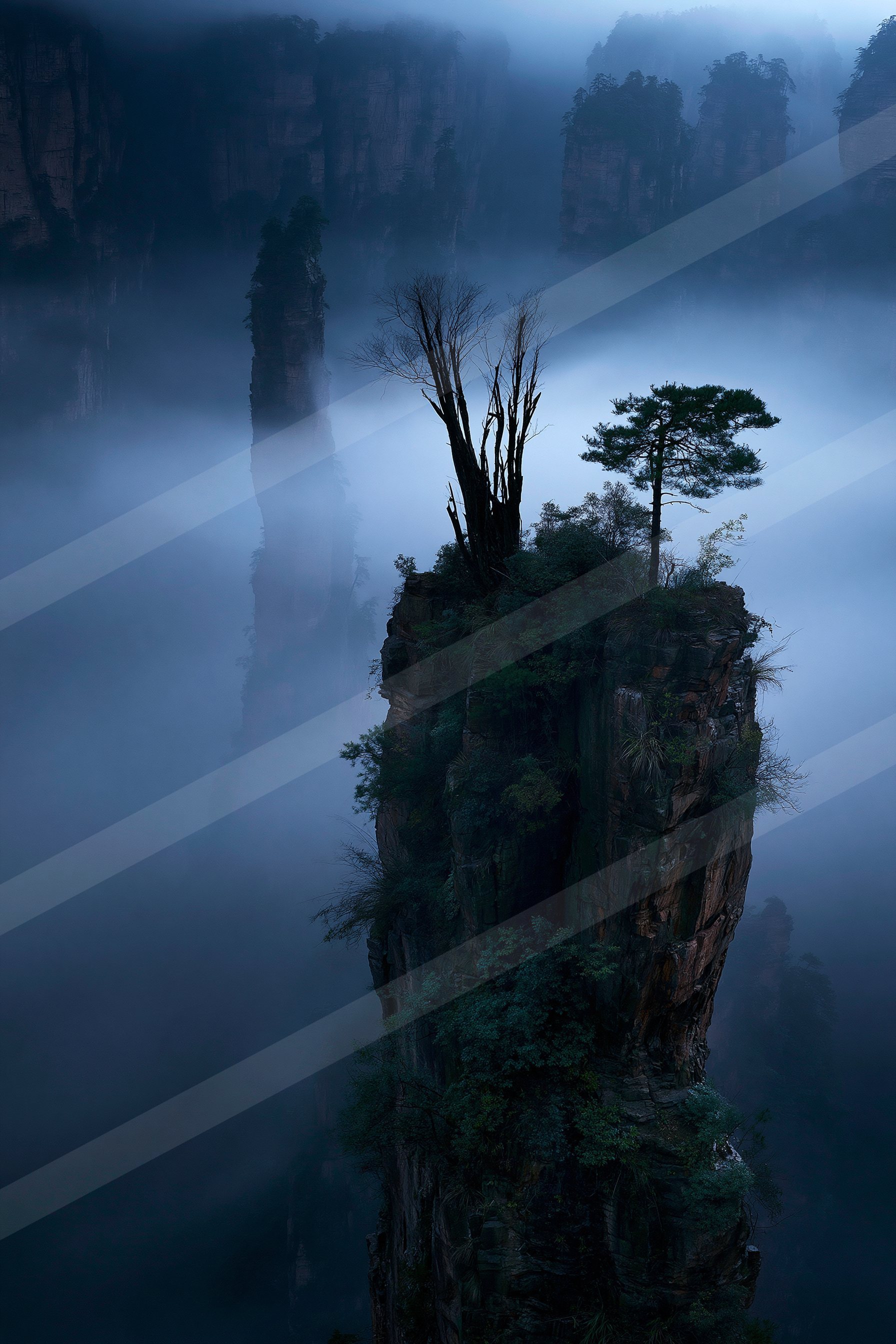 A mysterious landscape of a cliff, fog.