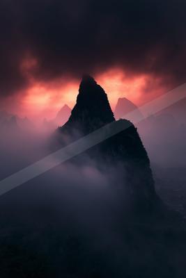 A moody landscape of mountains.