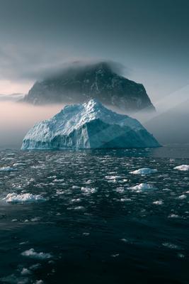 A bright landscape of mountains, ocean.