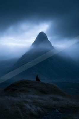 A night landscape of mountains, fog.