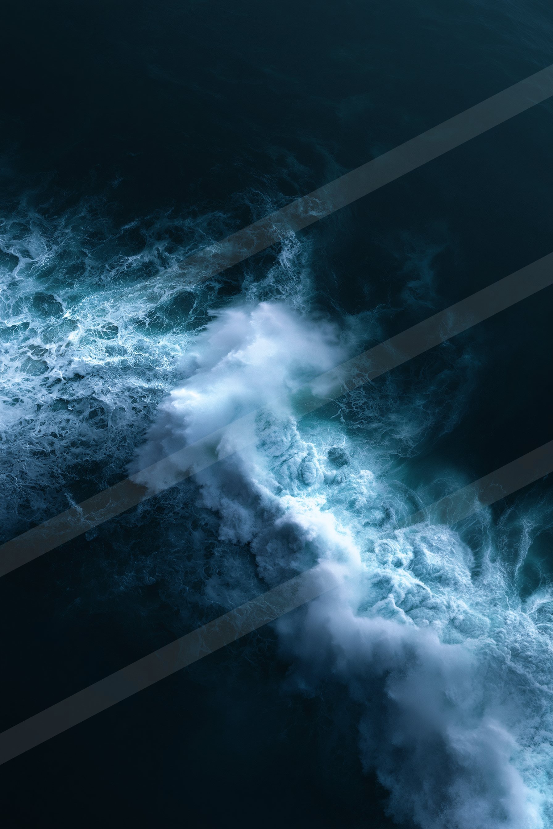 A dramatic nighttime ocean scene featuring crashing waves with bright white foam against a deep blue backdrop.