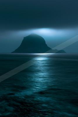 A night long exposure landscape of a volcano, reflection.
